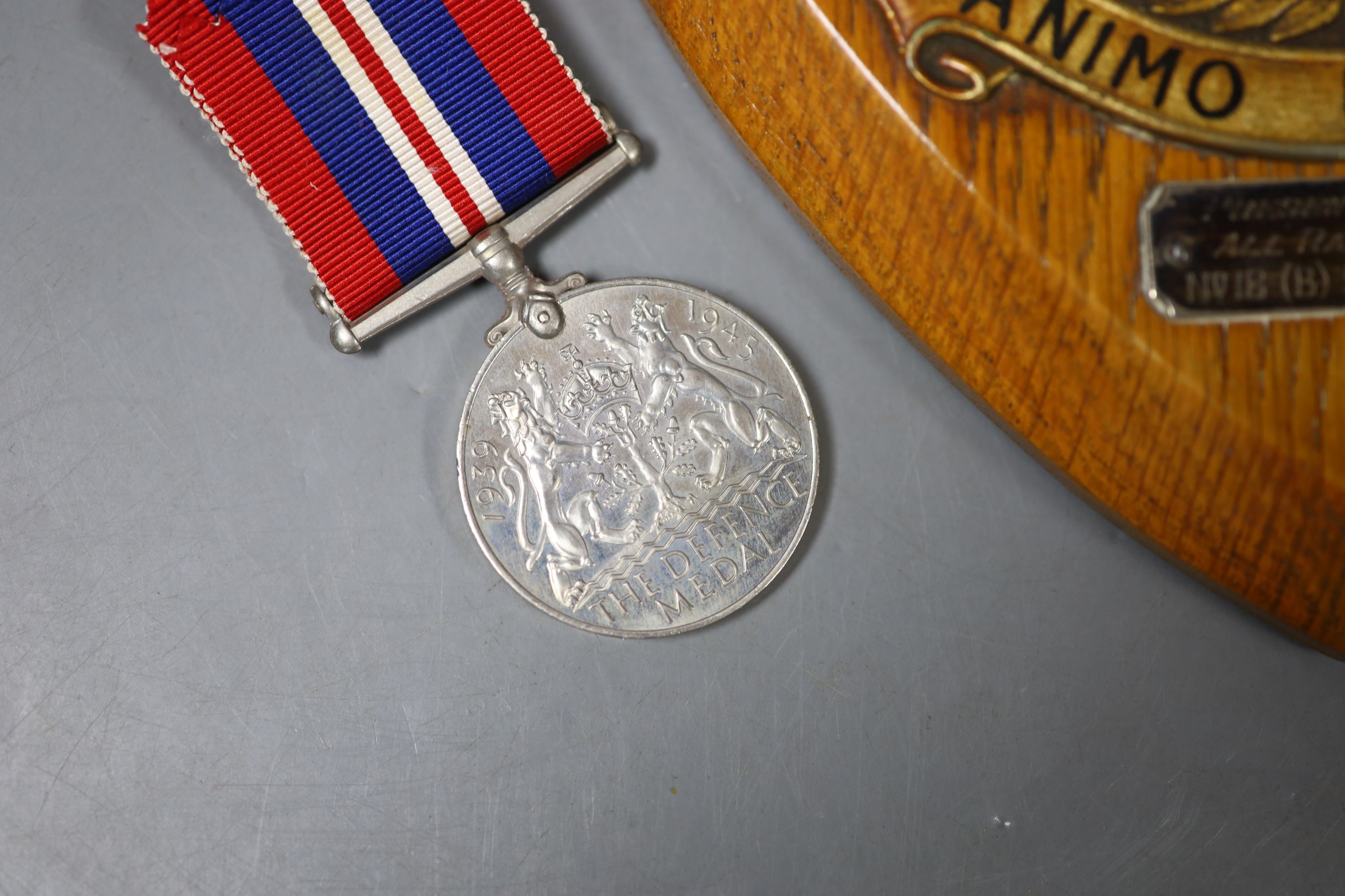 A group of three medals to Flight Sergeant H V Walder RAF 329595 including a George V RAF long service and good conduct medal and an RAF plaque, presented by all ranks of no.18 (B) squadron